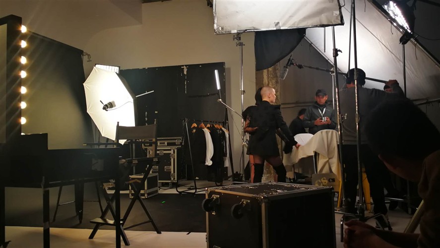 Shanghai camera crew working on a studio set with lighting and grip equipment