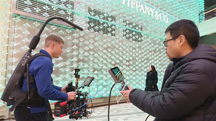 Shanghai production crew preparing camera and lighting gear inside a stylized interior location